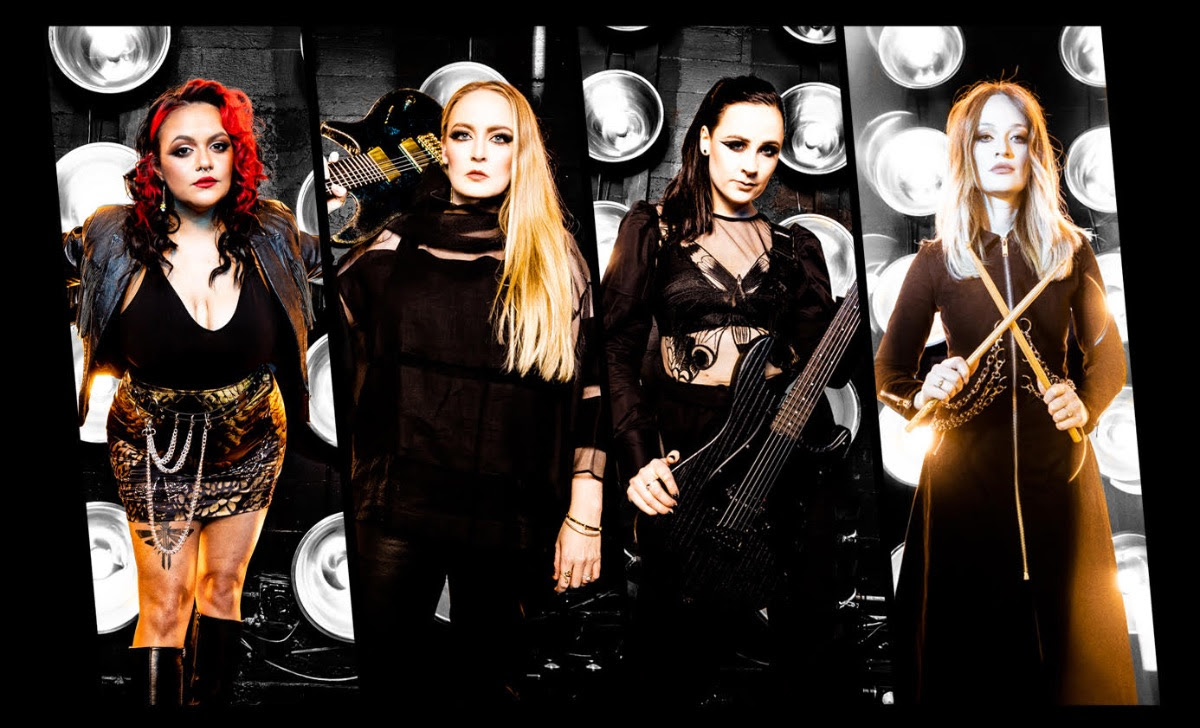 Members of Conquer Divide put together, each holding instruments.