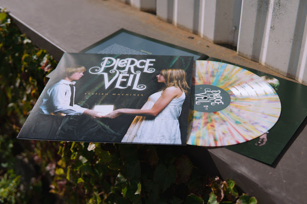 Vinyl Re-Press of Selfish Machines white with multicolor splatter.