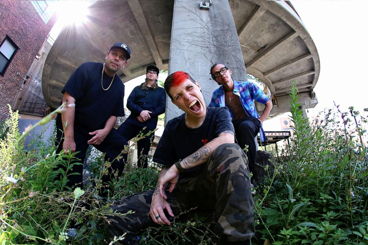 Band members outside looking down at the camera.